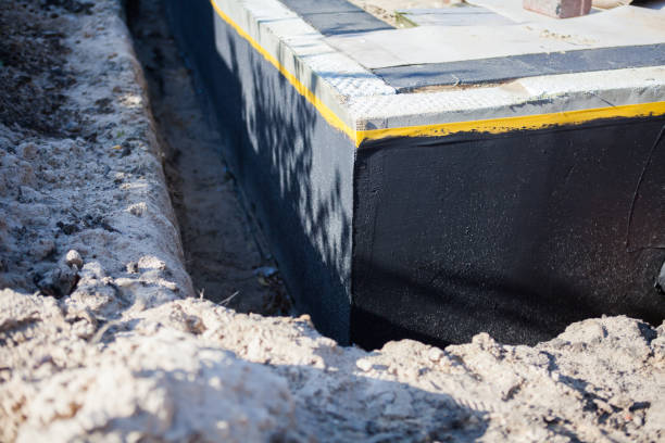 Professional Waterproofing technician working in Pleasant Lake, IN